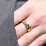 Men’s Cross Ring with East-West Baguette Gemstones – 10K Yellow Gold with Peridot and Emerald