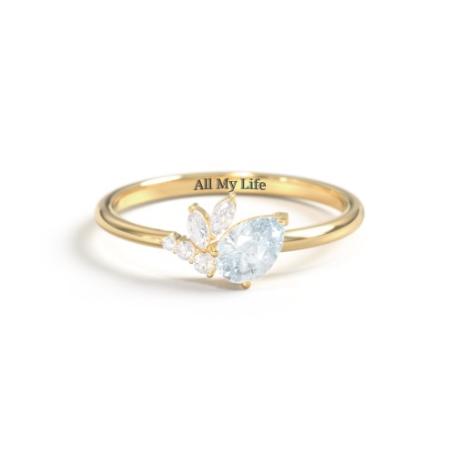 Tilted Pear Gemstone Ring with Cluster Accents – 10K Yellow Gold with Aquamarine and Cubic Zirconia