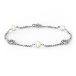Sterling Silver and Pearl Bracelet with Twisted Ring Charms