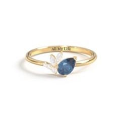 Tilted Pear Gemstone Ring with Cluster Accents – 10K White Gold with Blue Topaz and Cubic Zirconia