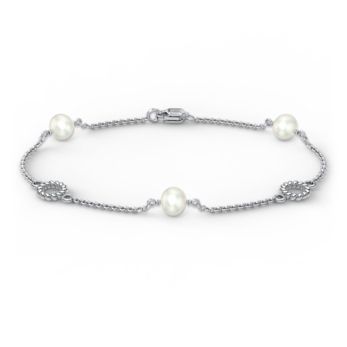 Sterling Silver and Pearl Bracelet with Twisted Ring Charms