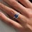 Oval Cut Gemstone Ring with Twisted Band and Accents – 10K Rose Gold with White Premium Zirconia and Fancy Blue Premium Zirconia