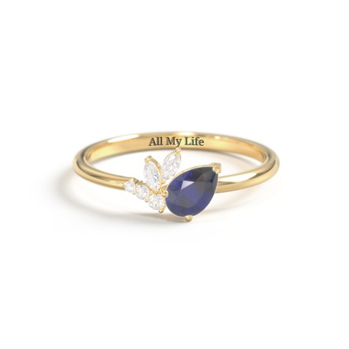 Tilted Pear Gemstone Ring with Cluster Accents – 10K Yellow Gold with Blue Sapphire and Cubic Zirconia