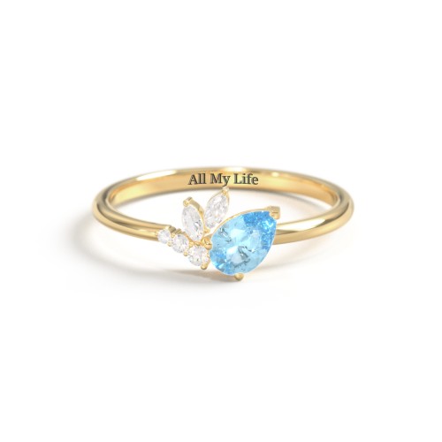 Tilted Pear Gemstone Ring with Cluster Accents – 10K Yellow Gold with Blue Topaz and Cubic Zirconia