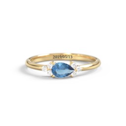 East-West Pear Gemstone Ring With Triple Side Stones in 18K Gold Plated Silver with Blue Topaz and Cubic Zirconia