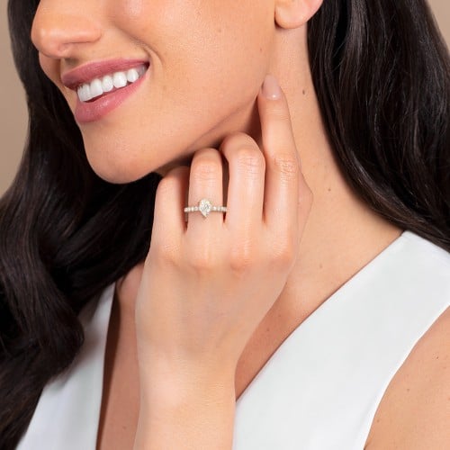 1.5 ct. (9x6mm) Pear Moissanite Engagement Ring With 2mm Side Stones